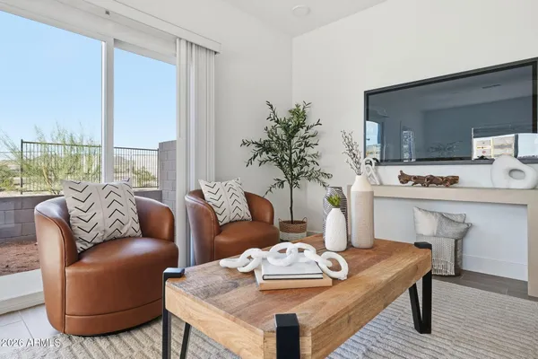 a living room with furniture and a table