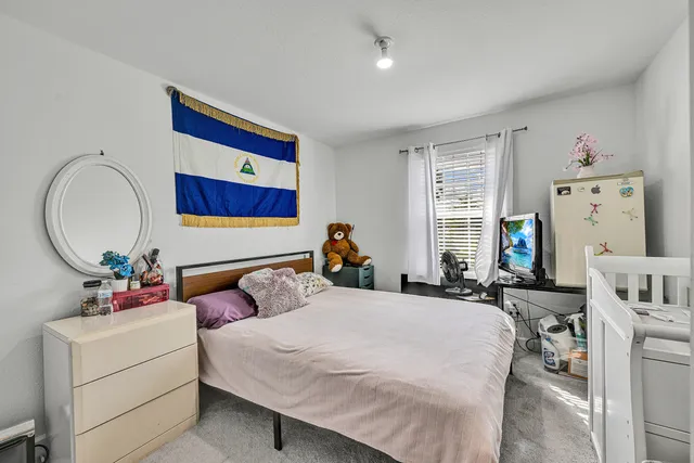 a view of a lake with houses in the back