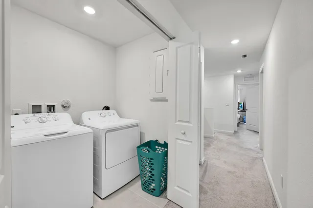 an aerial view of a city with a lake view