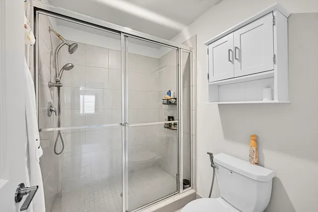 an aerial view of residential houses with outdoor space and swimming pool