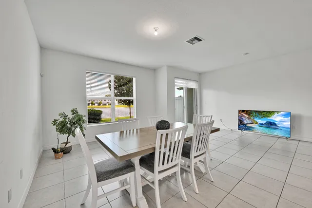 a bedroom with a bed and a chair