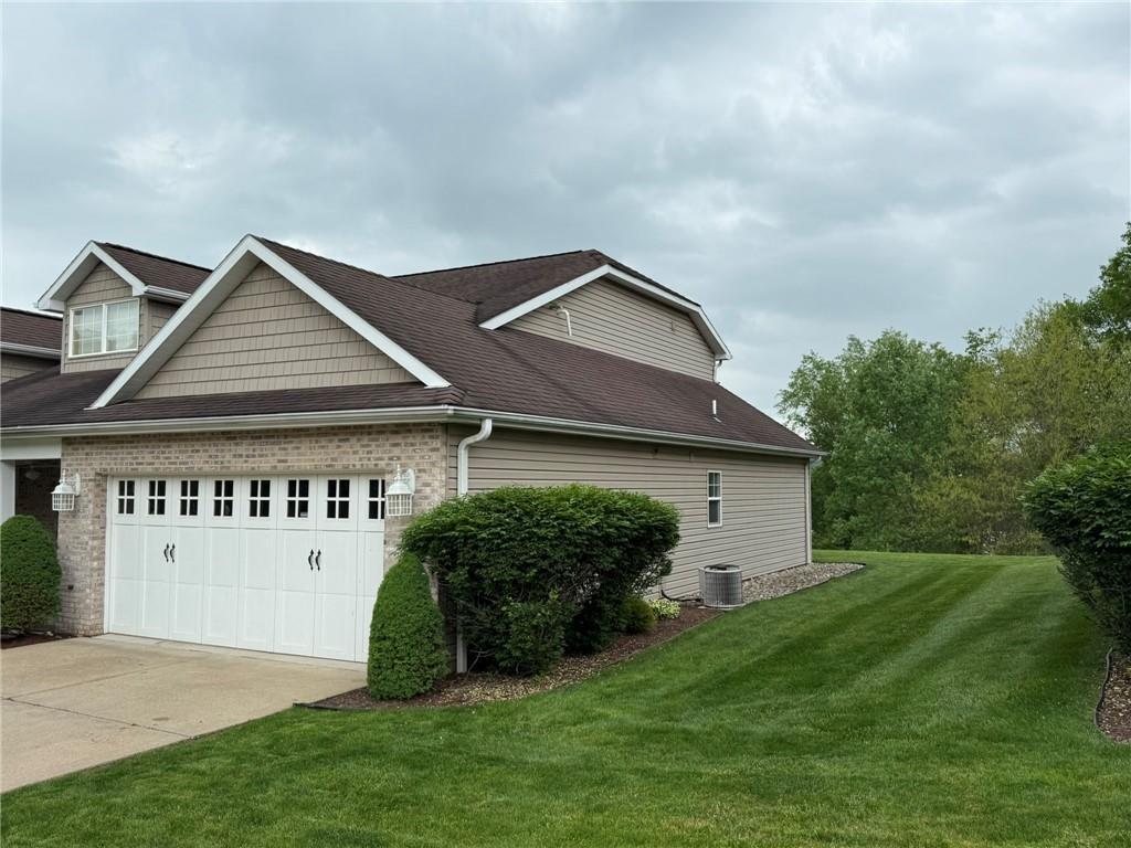 411 Chestnut Lane Apollo, PA 15613 - Photo 28 of 38 a front view of a house with a garden and yard
