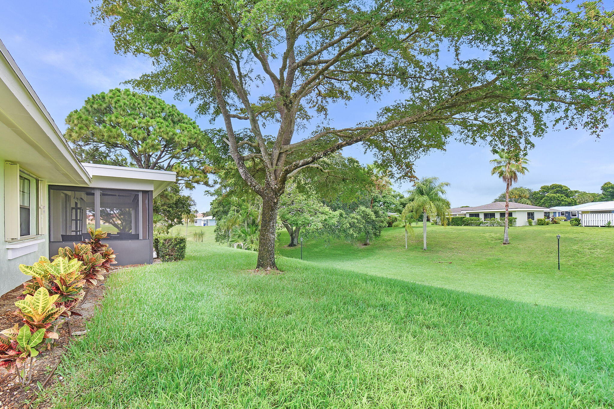 5251 Southeast Sea Island Way Stuart, FL 34997 - Photo 33 of 68 a view of a house with a garden
