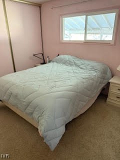 3815 Glen Street Reno, NV 89502 - Photo 16 of 24 a bed sitting in a bedroom next to a window
