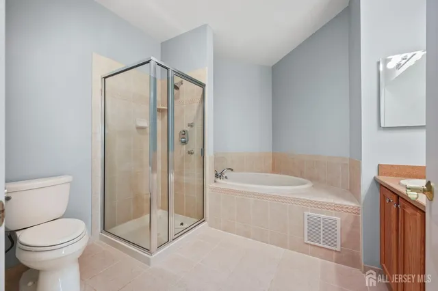 a bathroom with a toilet sink and shower