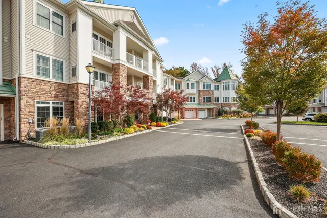 a view of a street with a building in the background