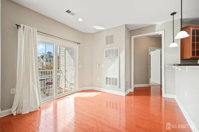a view of livingroom with hardwood floor and hallway