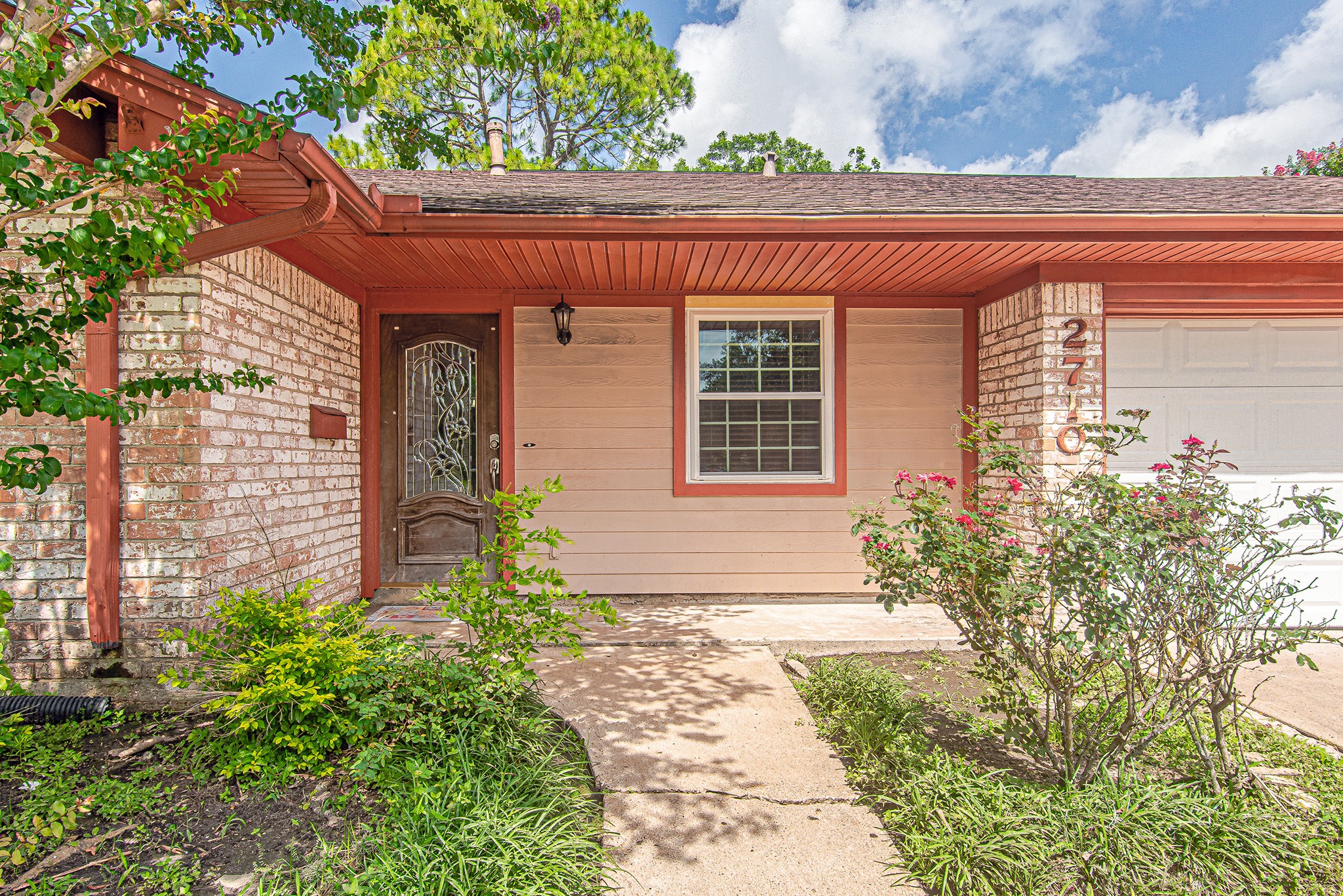 2710 Burke Road Pasadena, TX 77502 - Photo 3 of 28 Welcoming front entry with covered porch and landscaped walkway