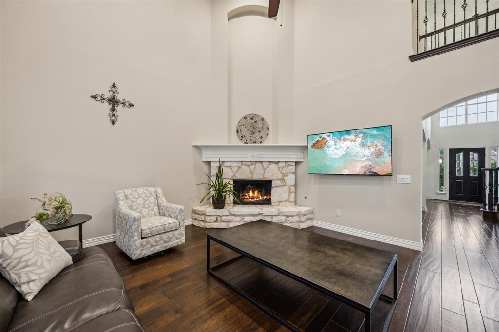 4528 Risinghill Drive Plano, TX 75024 - Photo 11 of 40 a living room with furniture and a fireplace