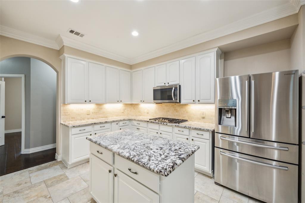 4528 Risinghill Drive Plano, TX 75024 - Photo 13 of 40 a kitchen with stainless steel appliances granite countertop a refrigerator and a stove top oven
