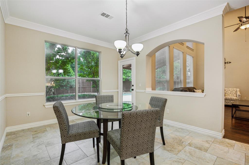 4528 Risinghill Drive Plano, TX 75024 - Photo 15 of 40 a dining room with furniture a chandelier and window
