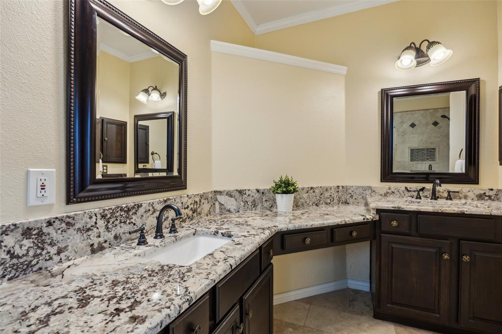 4528 Risinghill Drive Plano, TX 75024 - Photo 22 of 40 a bathroom with a granite countertop sink and a mirror