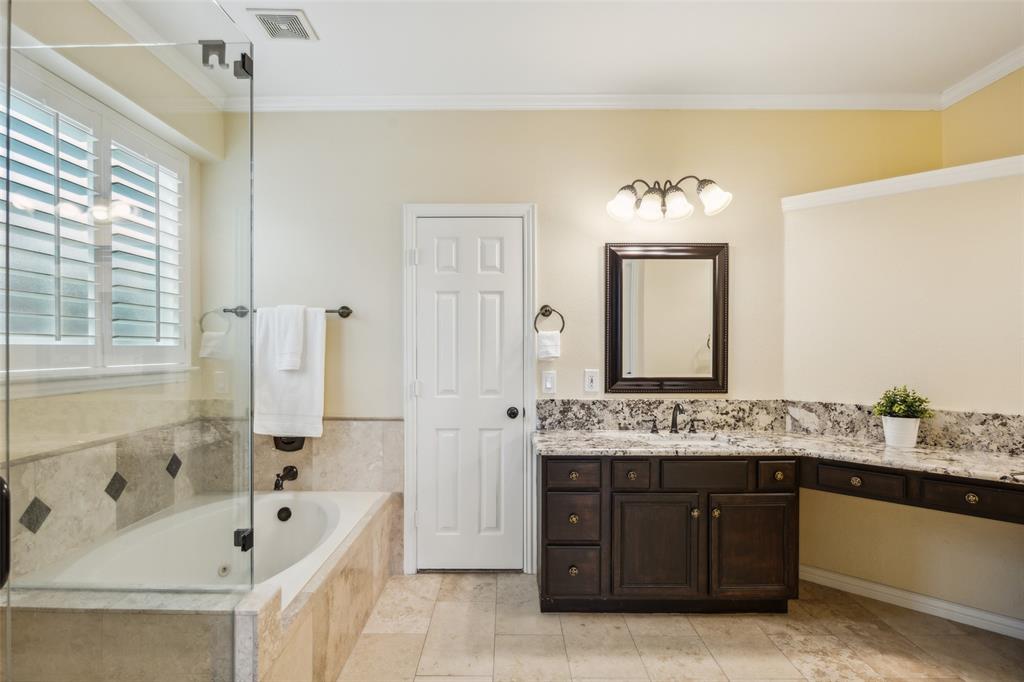4528 Risinghill Drive Plano, TX 75024 - Photo 23 of 40 a spacious bathroom with a tub sink and mirror