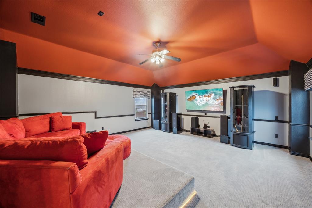 4528 Risinghill Drive Plano, TX 75024 - Photo 30 of 40 a living room with furniture a refrigerator and a chandelier