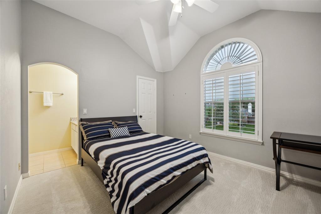 4528 Risinghill Drive Plano, TX 75024 - Photo 32 of 40 a bedroom with a bed and a window