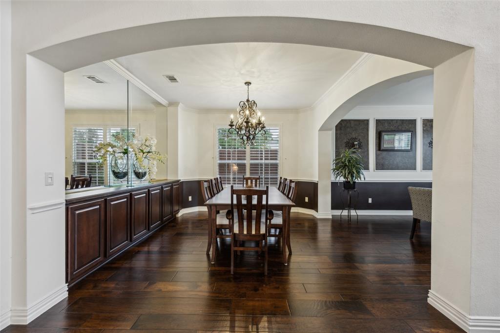4528 Risinghill Drive Plano, TX 75024 - Photo 7 of 40 a very nice looking dining room with hardwood floor and a chandelier