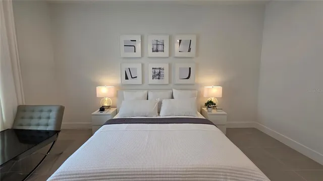 a bathroom with a granite countertop toilet and a sink