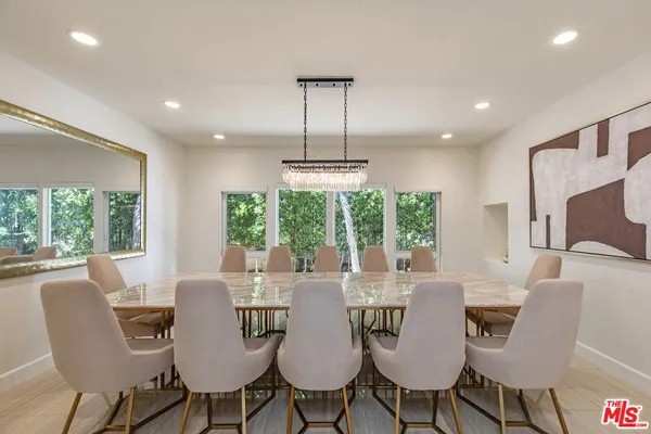 a view of a dining room with furniture window and outside view