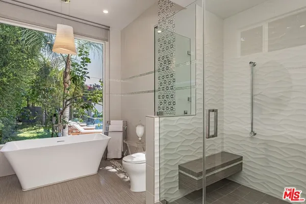 a bathroom with a toilet a sink and bathtub