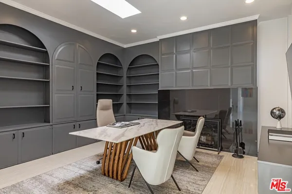 a dining room with furniture and wooden floor