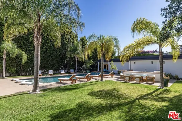 a view of a park with swings and slides