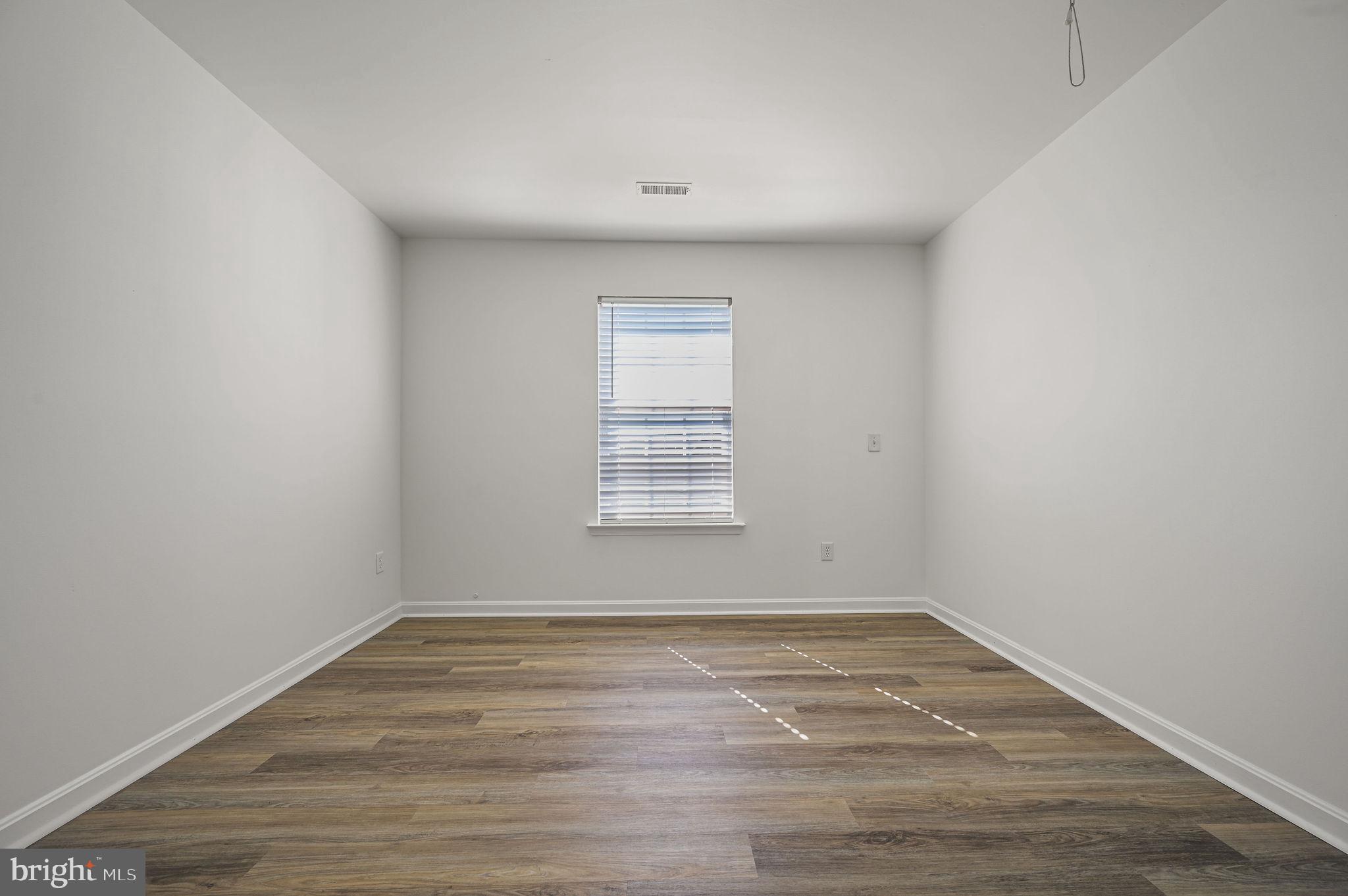 44 Moriarty Street Dover, DE 19901 - Photo 11 of 15 wooden floor in an empty room