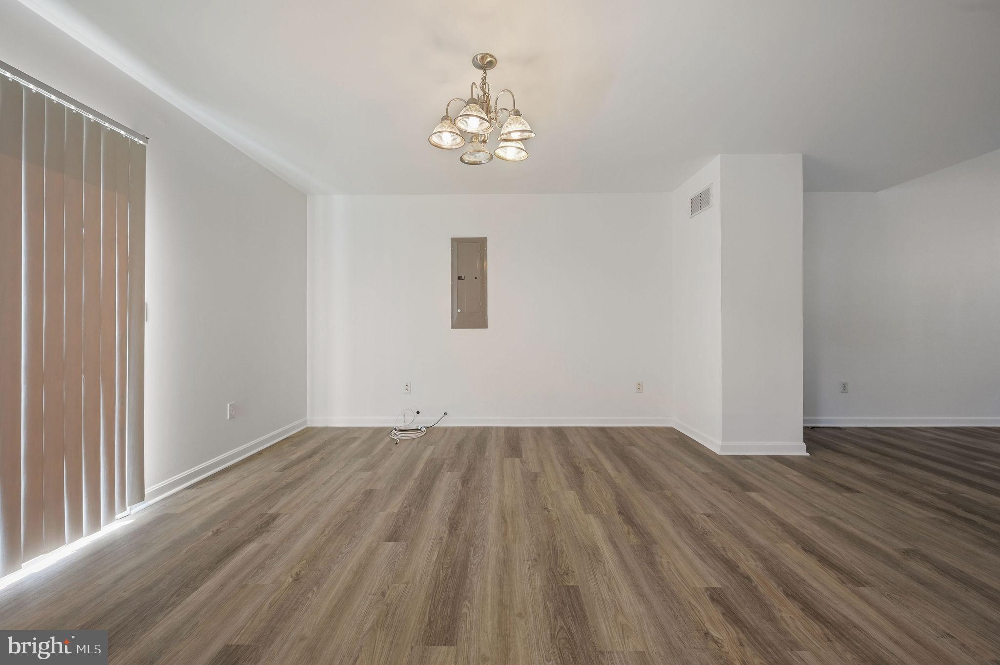 44 Moriarty Street Dover, DE 19901 - Photo 5 of 15 a view of an empty room with wooden floor and a window