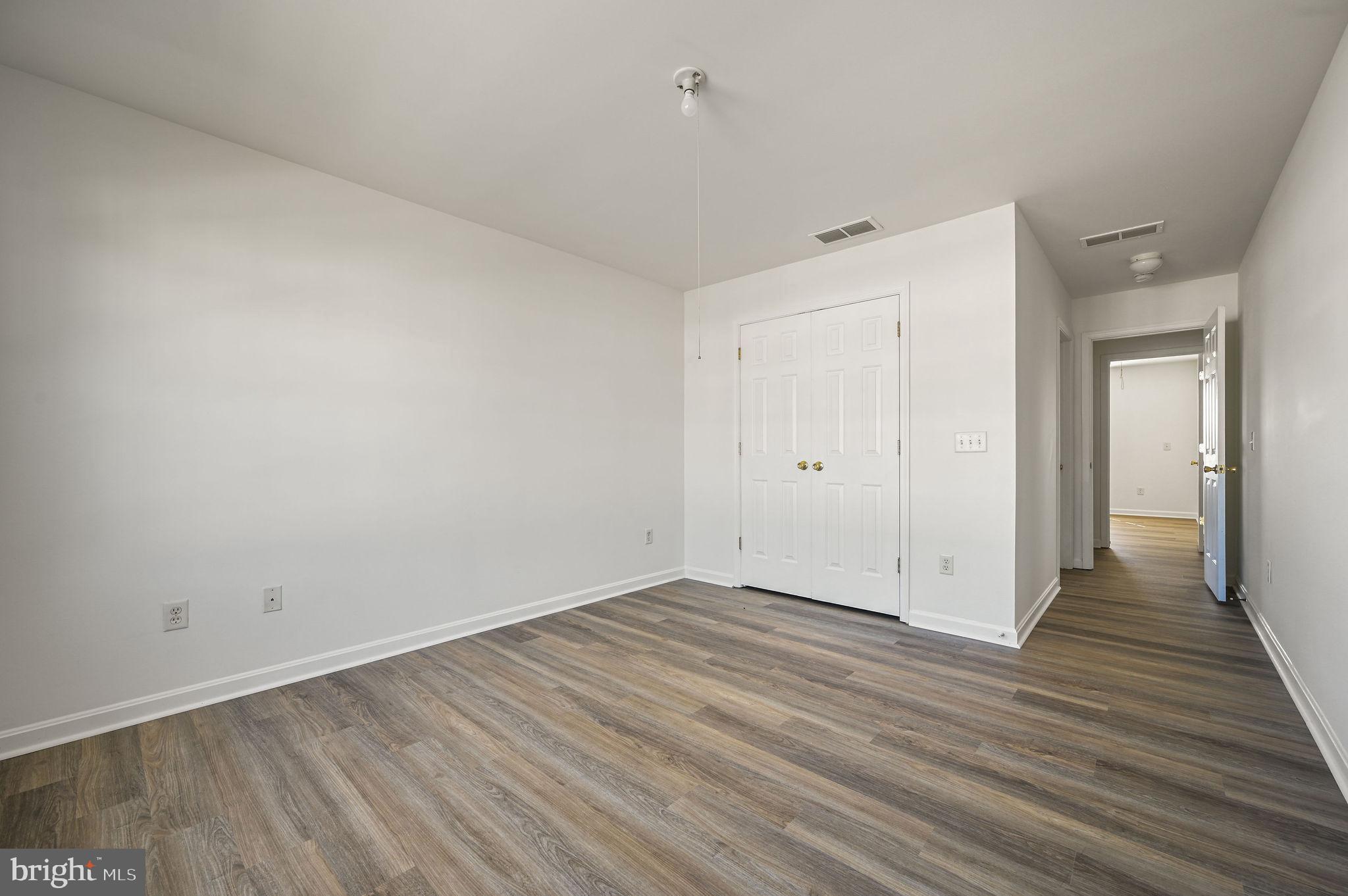 44 Moriarty Street Dover, DE 19901 - Photo 9 of 15 wooden floor in an empty room