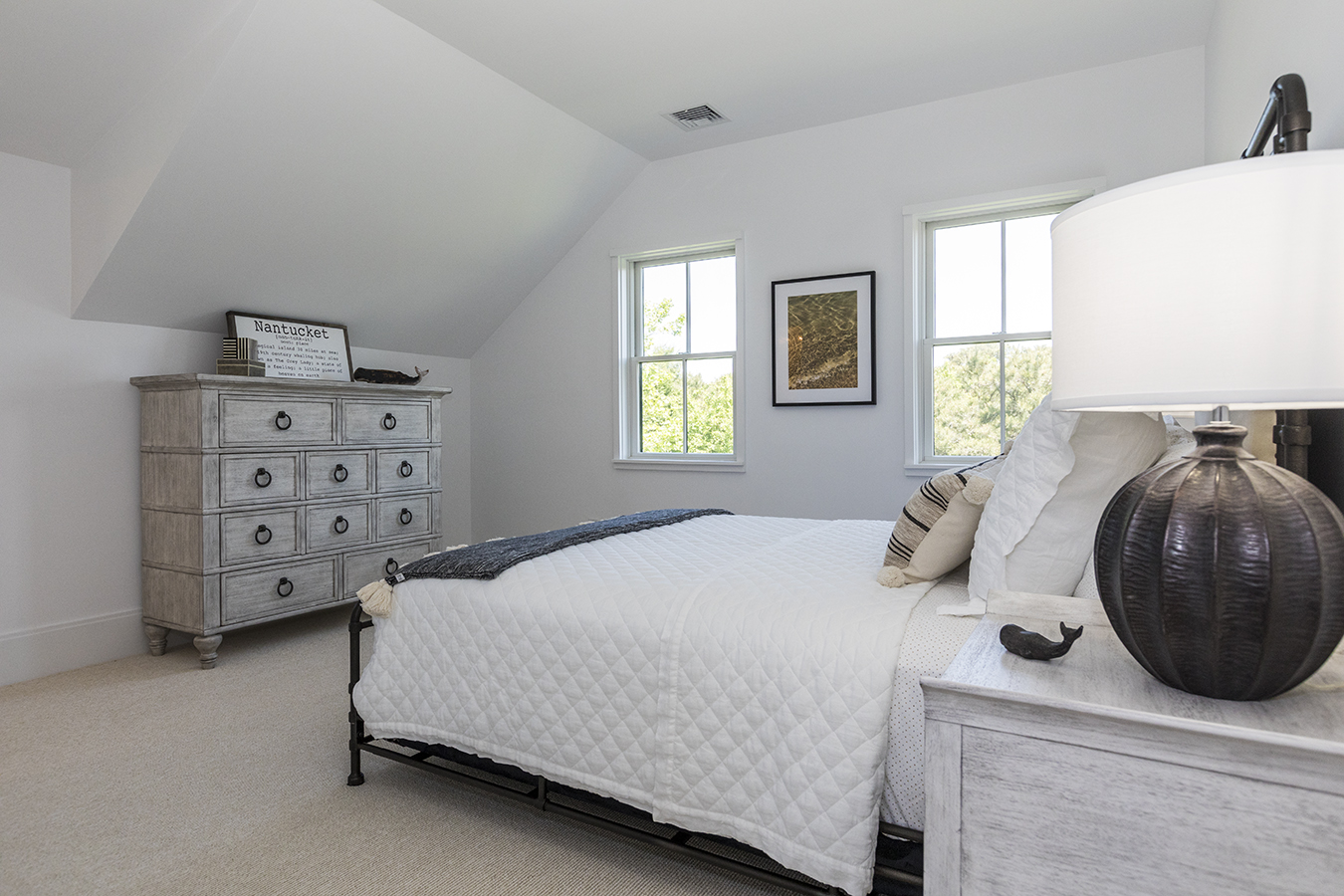12 Wood Lily Road Nantucket, MA 02554 - Photo 45 of 70 a bedroom with a bed and a dresser