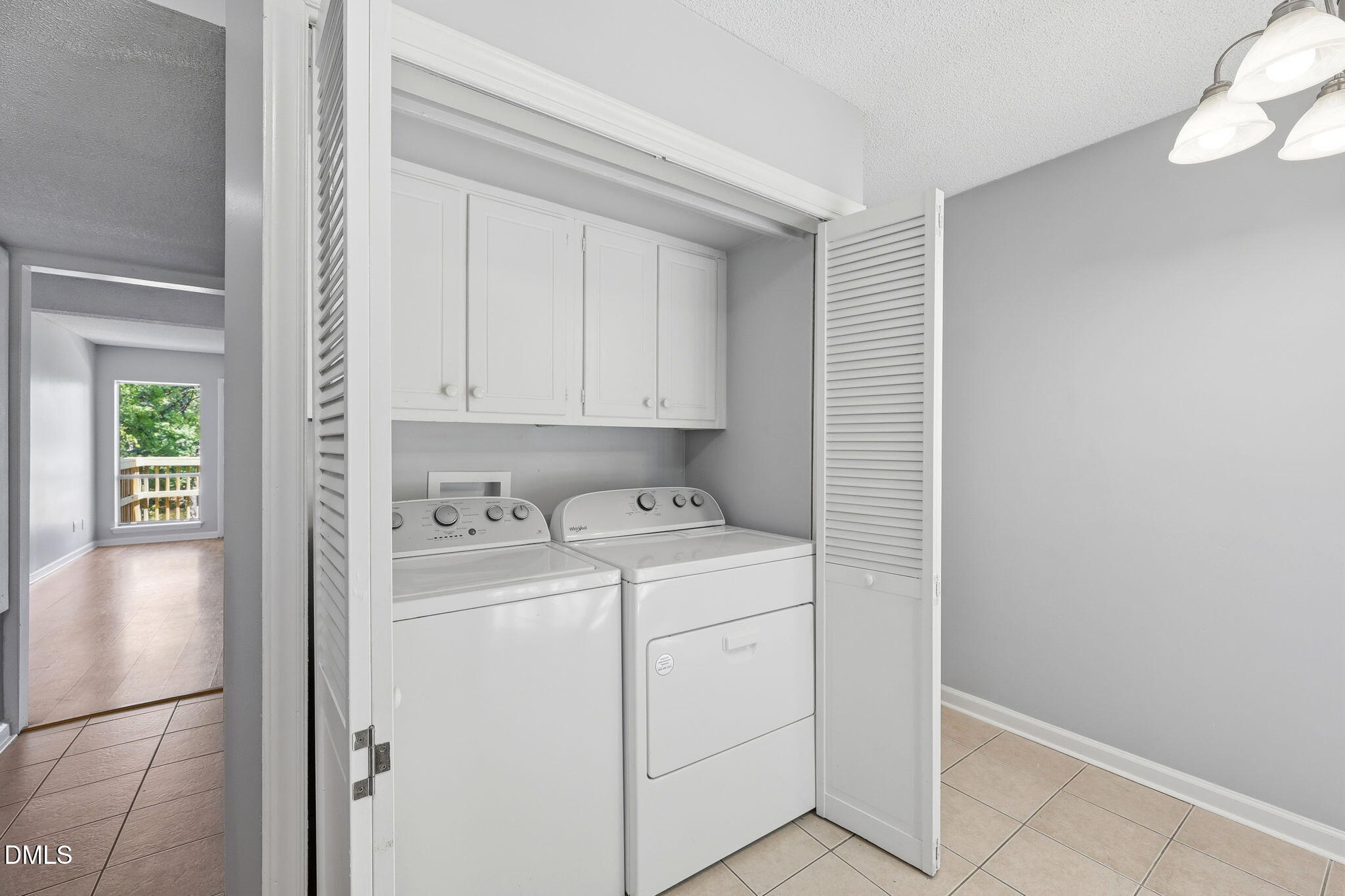 5043 Tall Pines Court Raleigh, NC 27609 - Photo 7 of 37 a view of storage and utility room with washer and dryer