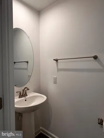 a bathroom with a sink and mirror