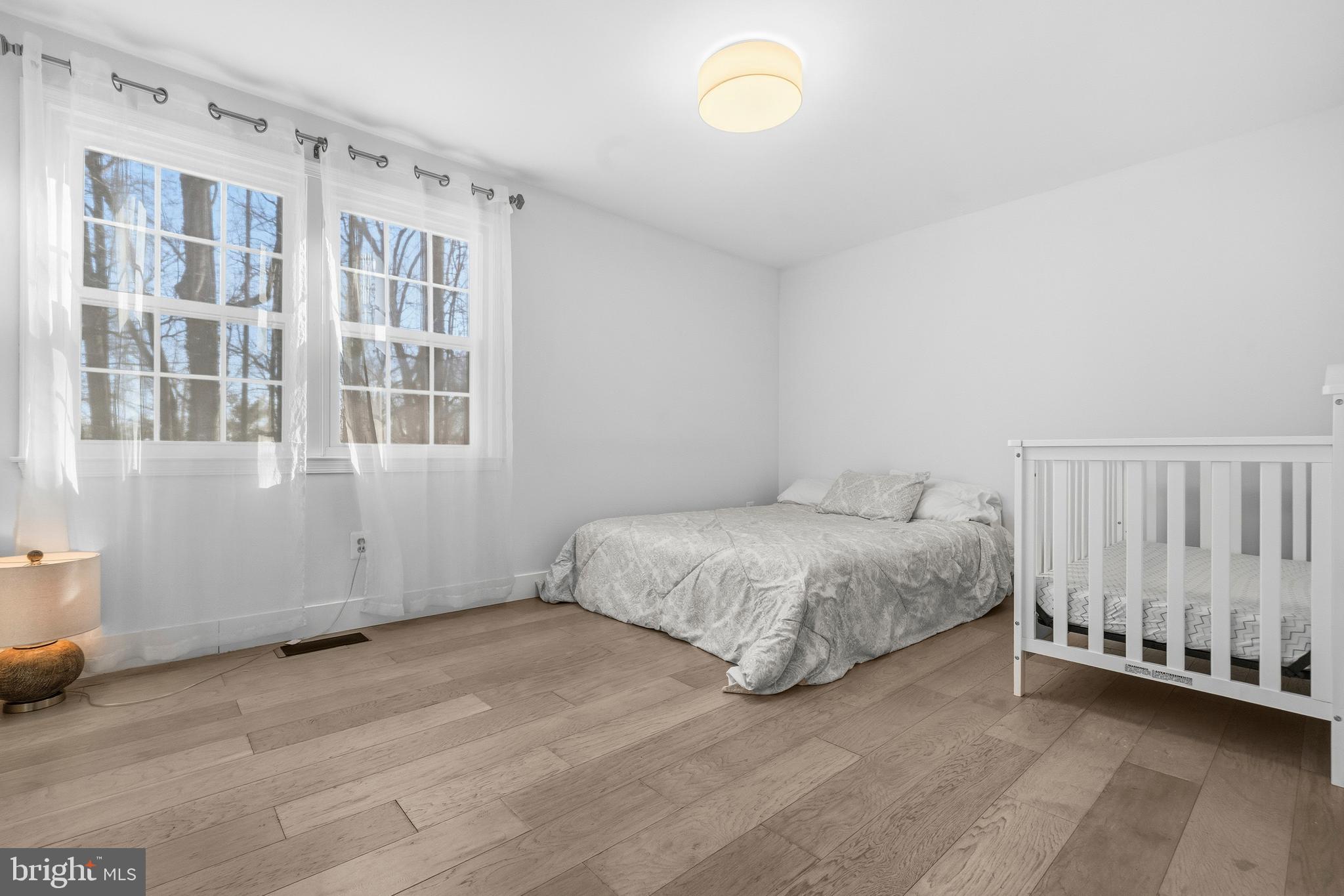 2901 Everleigh Way Fairfax, VA 22031 - Photo 14 of 34 a spacious bedroom with a bed and a window