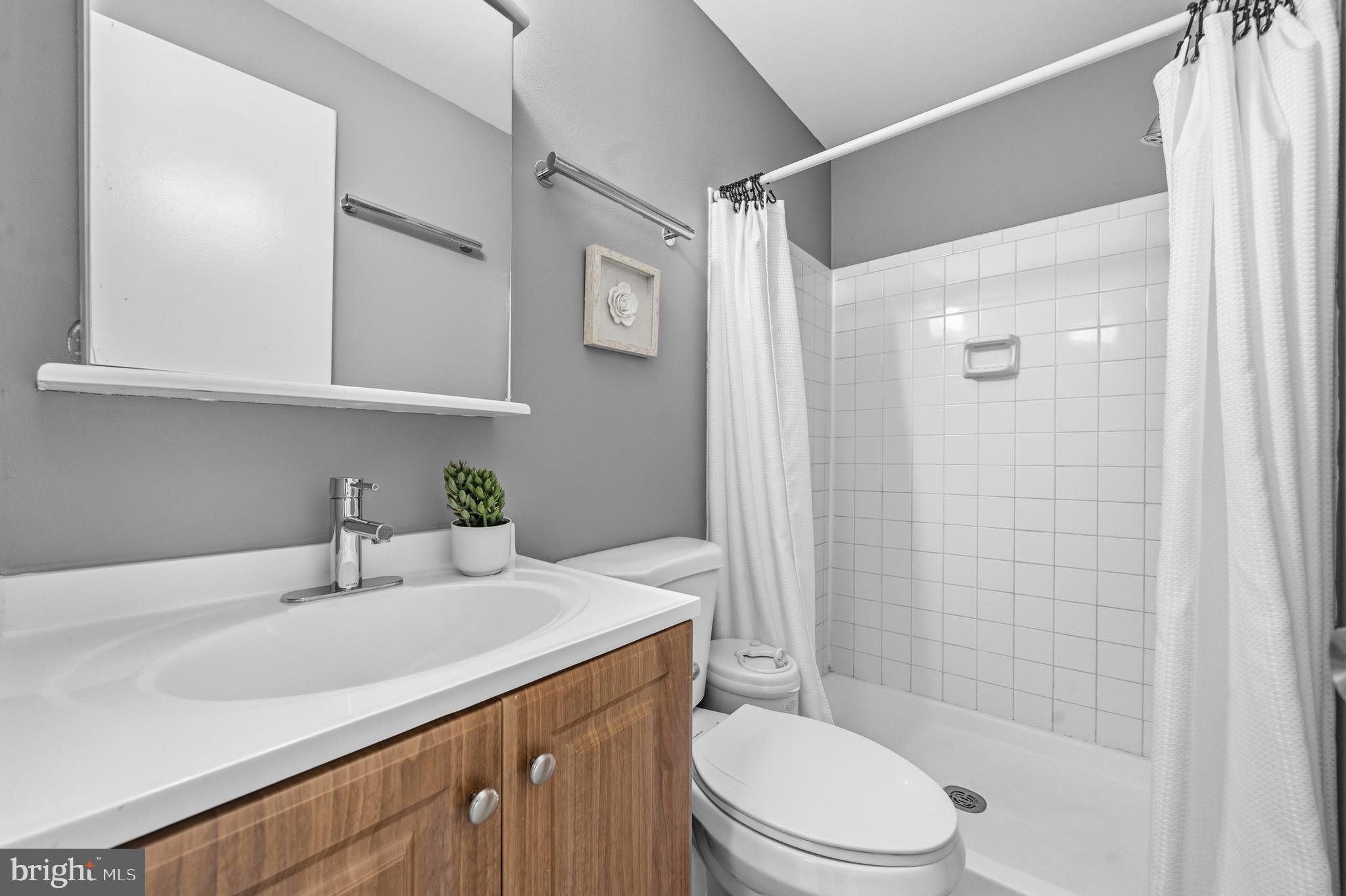 2901 Everleigh Way Fairfax, VA 22031 - Photo 17 of 34 a bathroom with a sink a toilet and shower