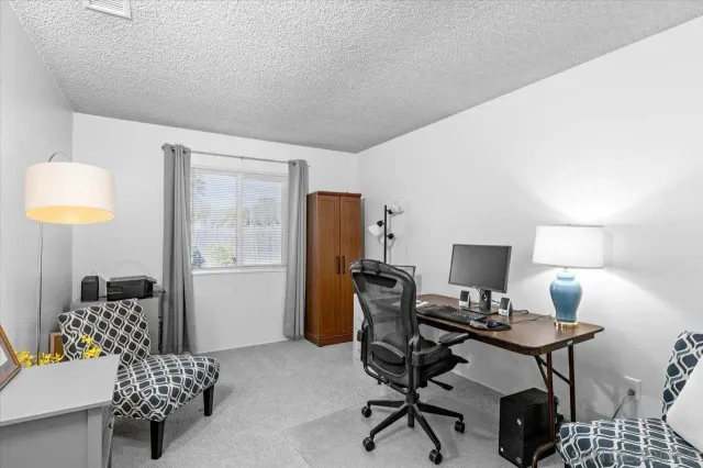 a workspace with furniture and lamp