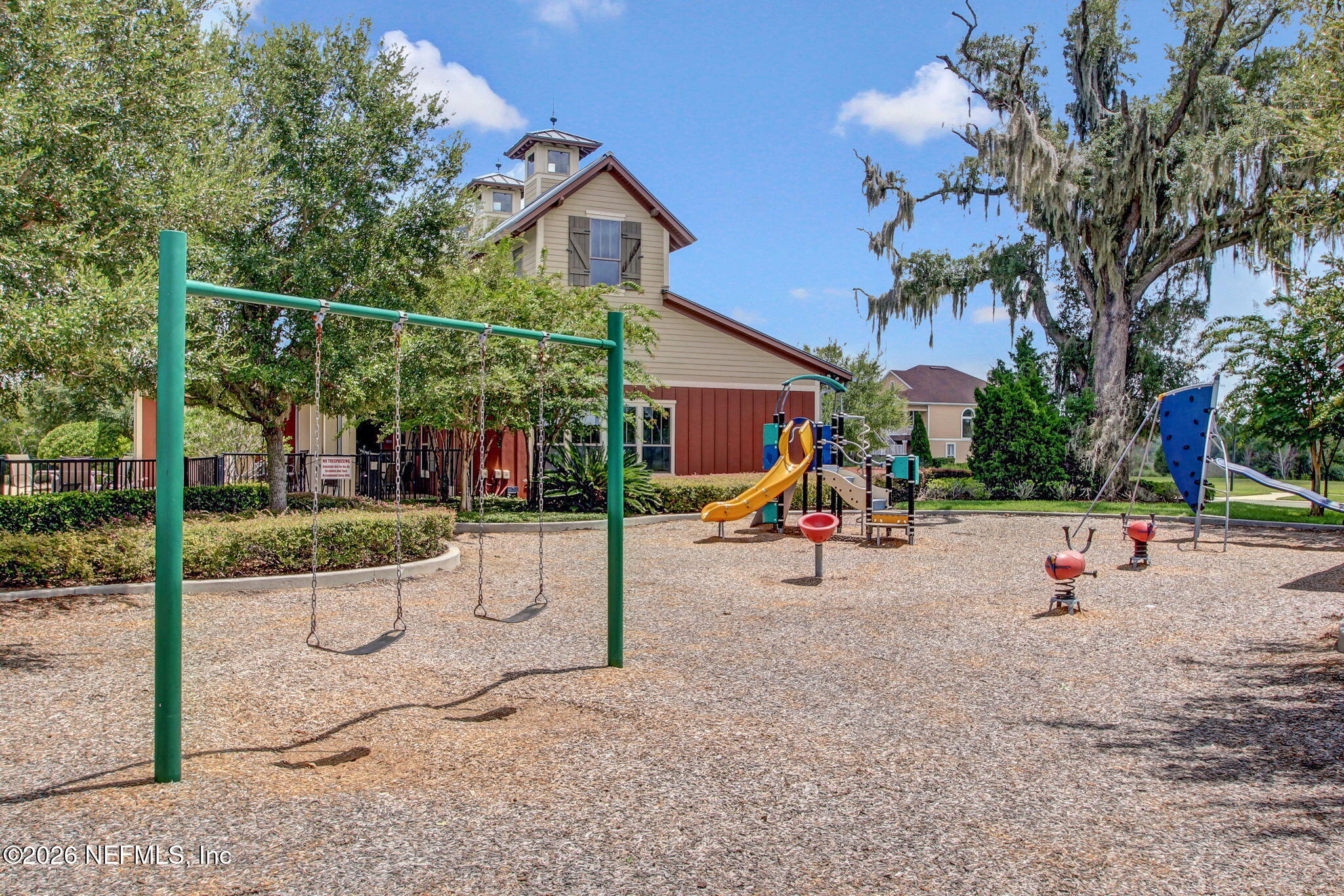 12198 Ridge Crossing Way Jacksonville, FL 32226 - Photo 65 of 67 a view of a park with swings and slides