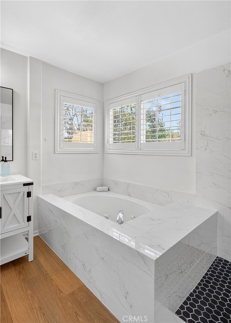 31928 Cercle Chambertin Temecula, CA 92591 - Photo 40 of 74 a bathroom with a bathtub and a sink
