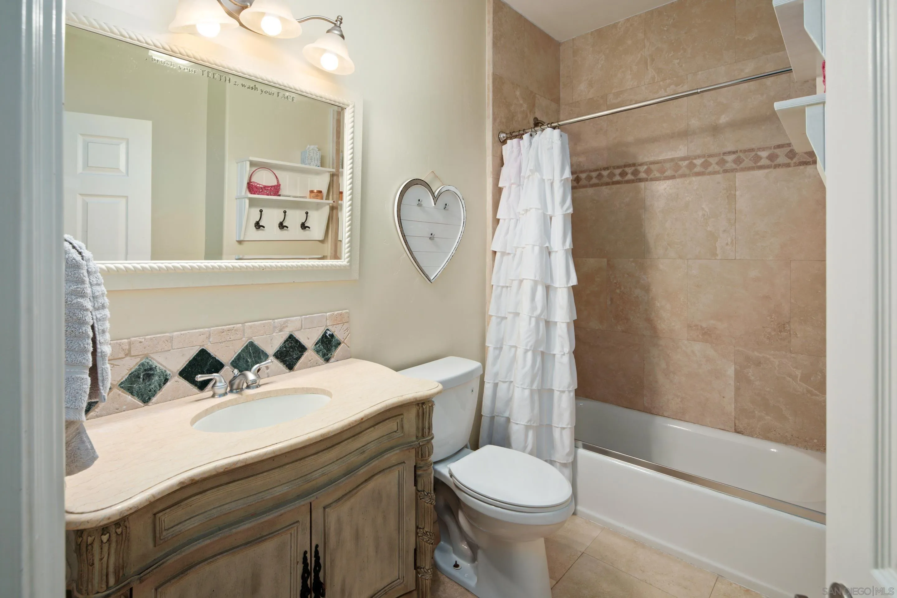 761 Ocean Crest Road Cardiff, CA 92007 - Photo 18 of 37 a bathroom with a sink toilet and shower