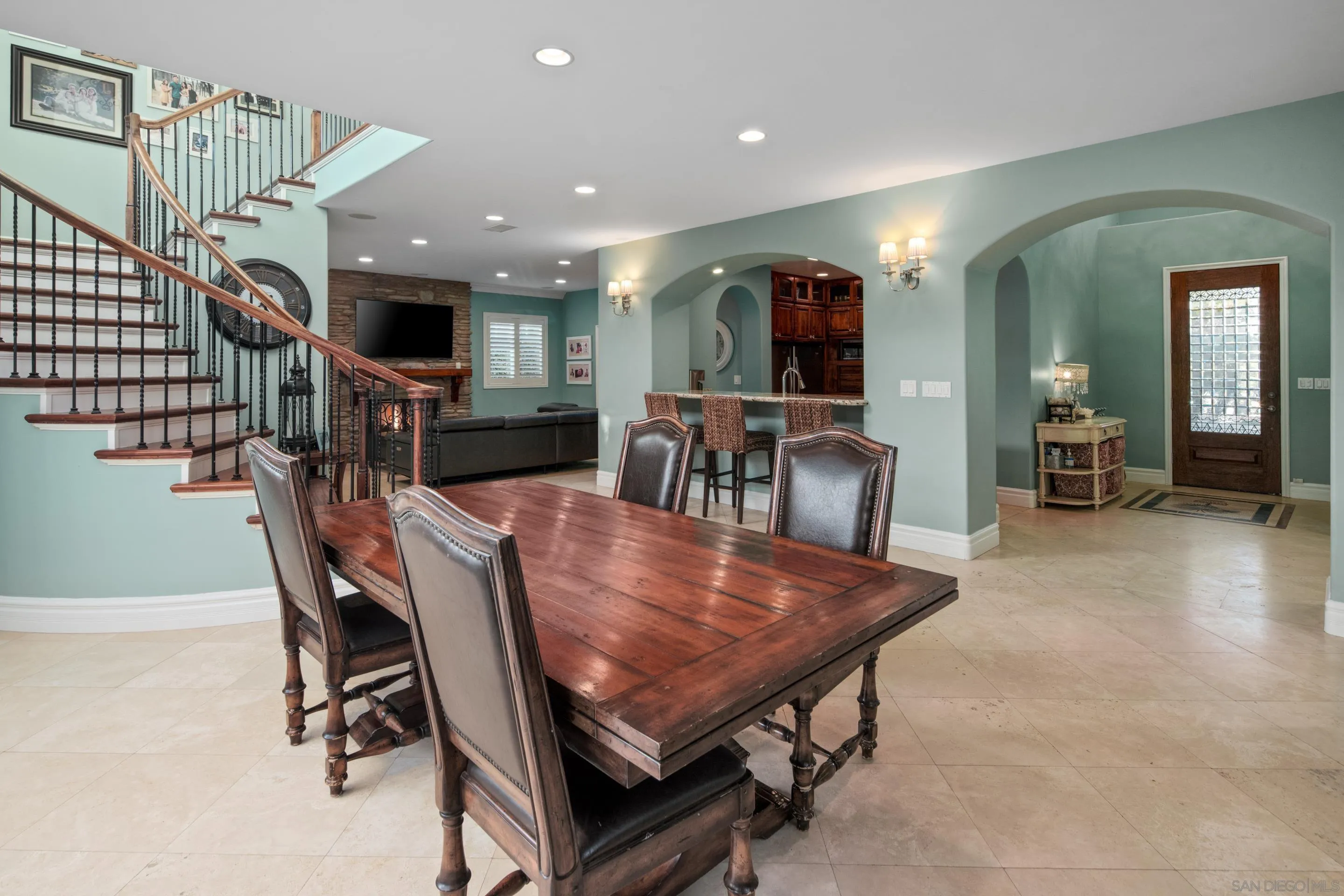761 Ocean Crest Road Cardiff, CA 92007 - Photo 19 of 37 a dining room with furniture and a flat screen tv