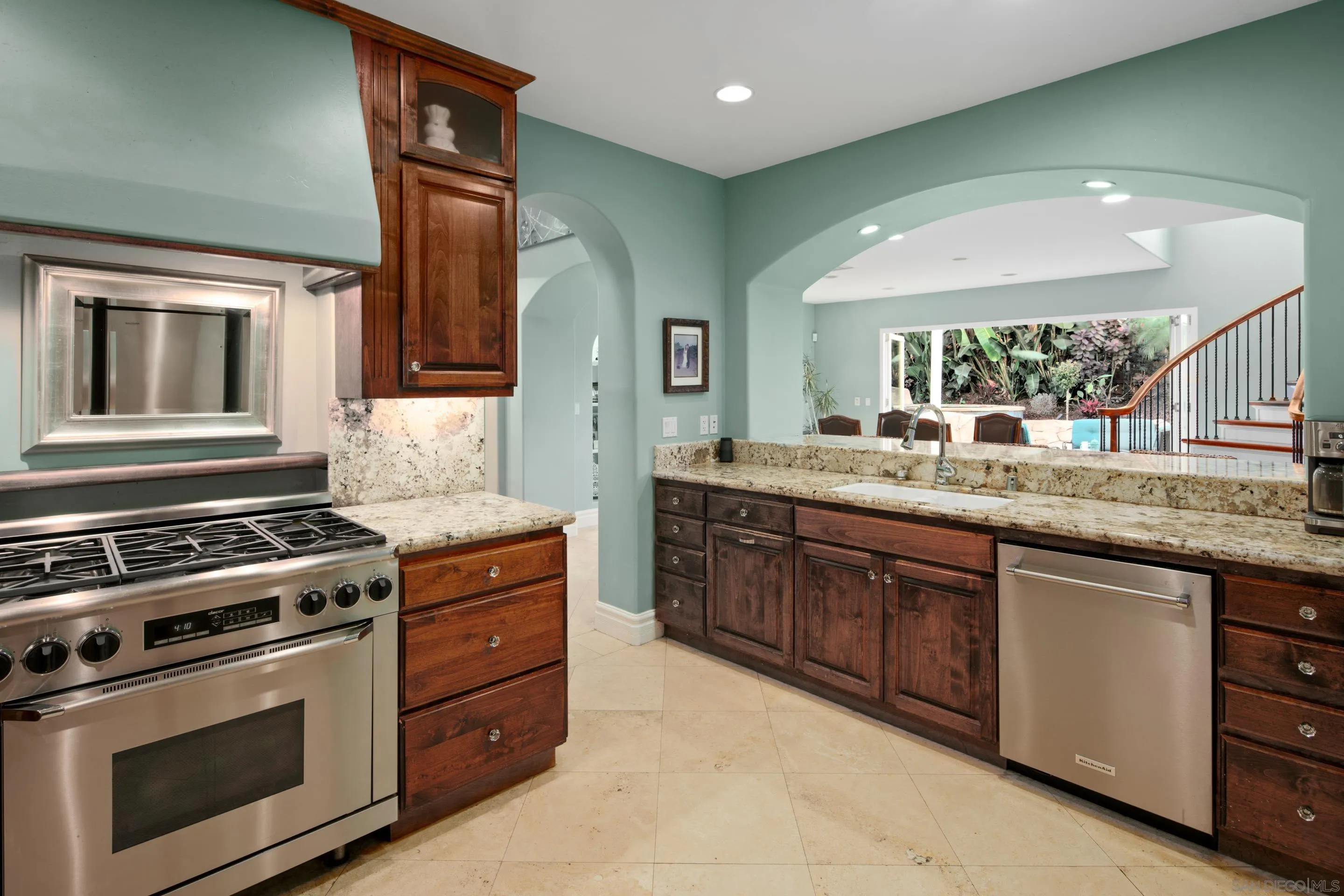 761 Ocean Crest Road Cardiff, CA 92007 - Photo 21 of 37 a kitchen with stainless steel appliances granite countertop a stove and a sink