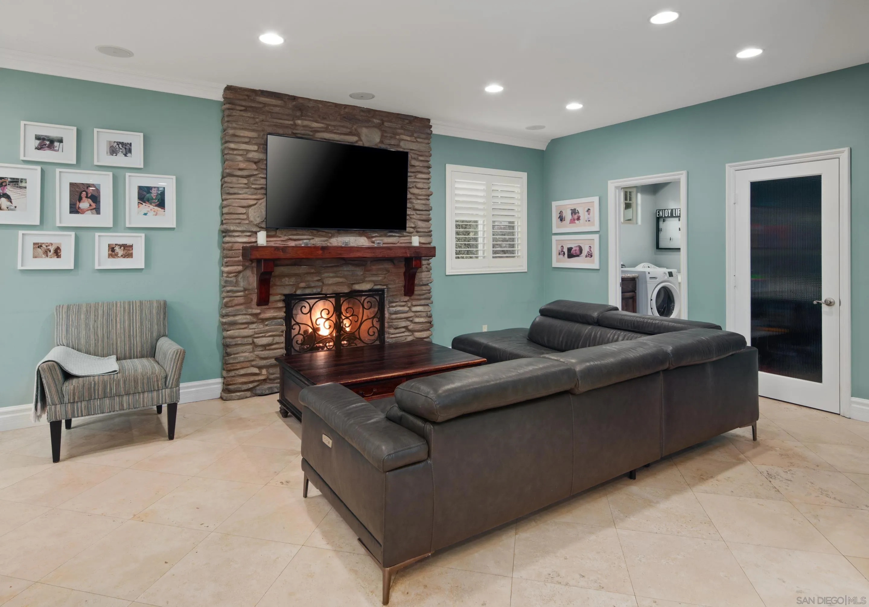 761 Ocean Crest Road Cardiff, CA 92007 - Photo 23 of 37 a living room with furniture and a fireplace