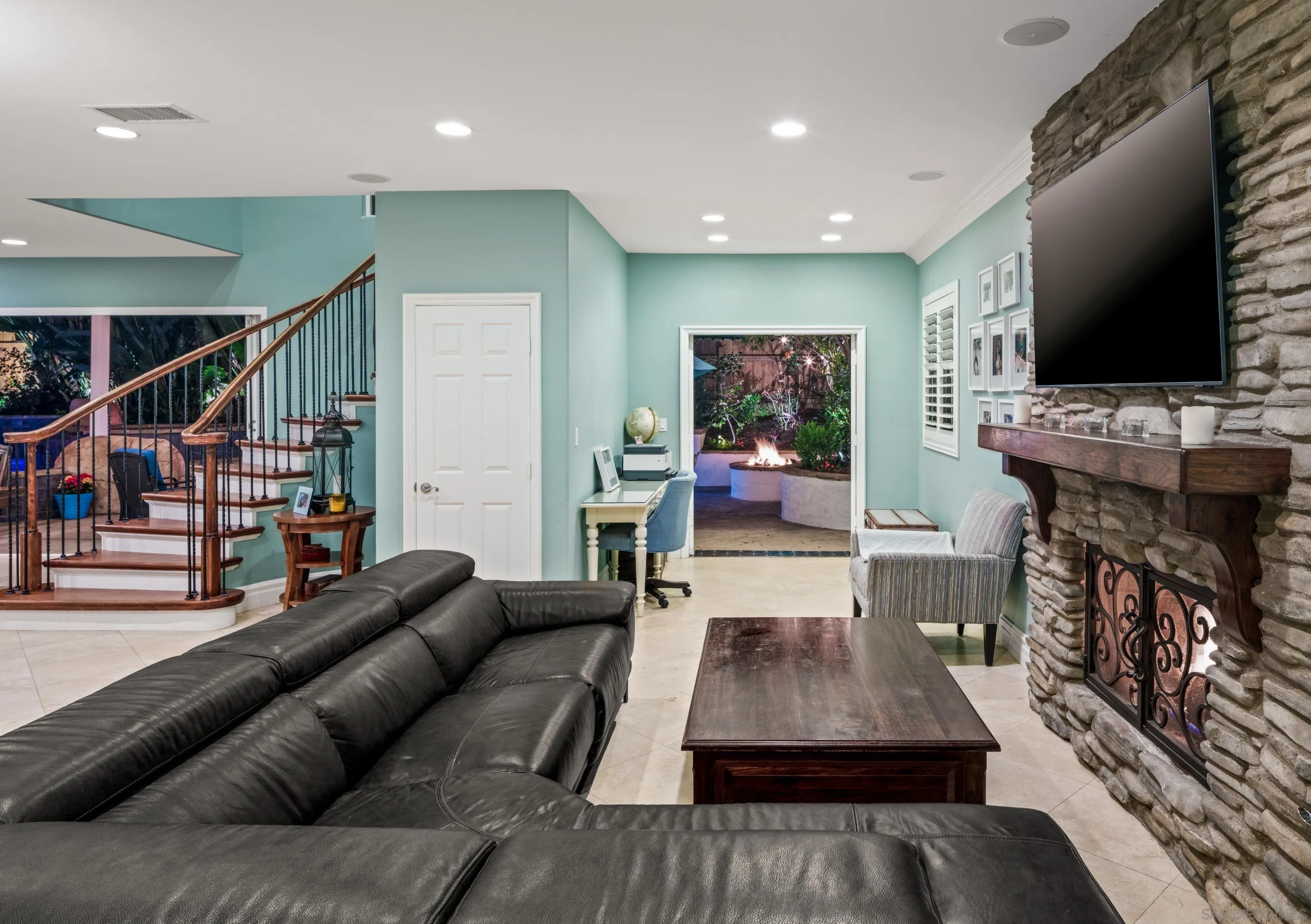 761 Ocean Crest Road Cardiff, CA 92007 - Photo 24 of 37 a living room with furniture and a flat screen tv