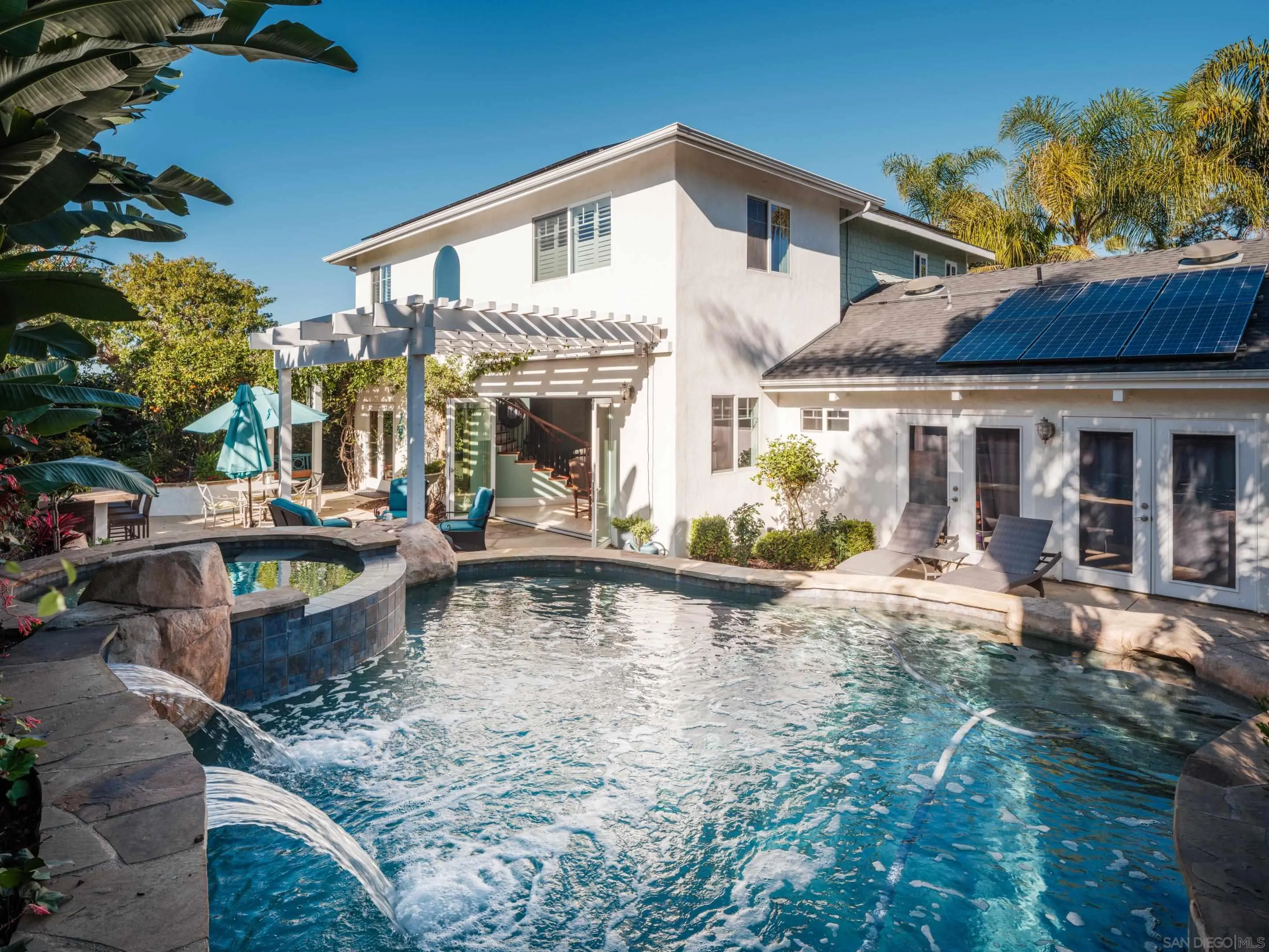 761 Ocean Crest Road Cardiff, CA 92007 - Photo 4 of 37 a view of a house with pool and chairs