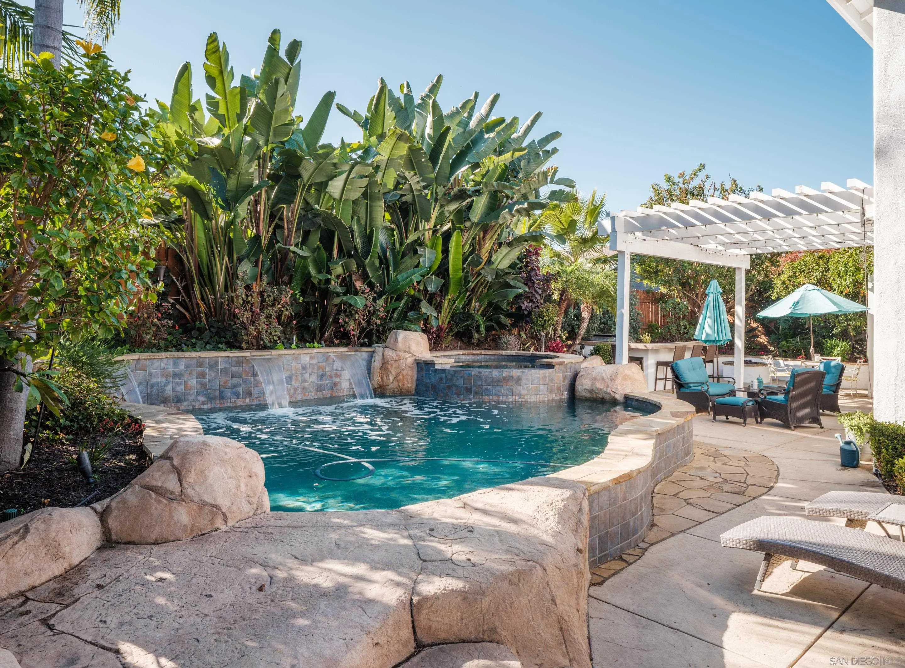 761 Ocean Crest Road Cardiff, CA 92007 - Photo 5 of 37 a view of a backyard with plants and patio
