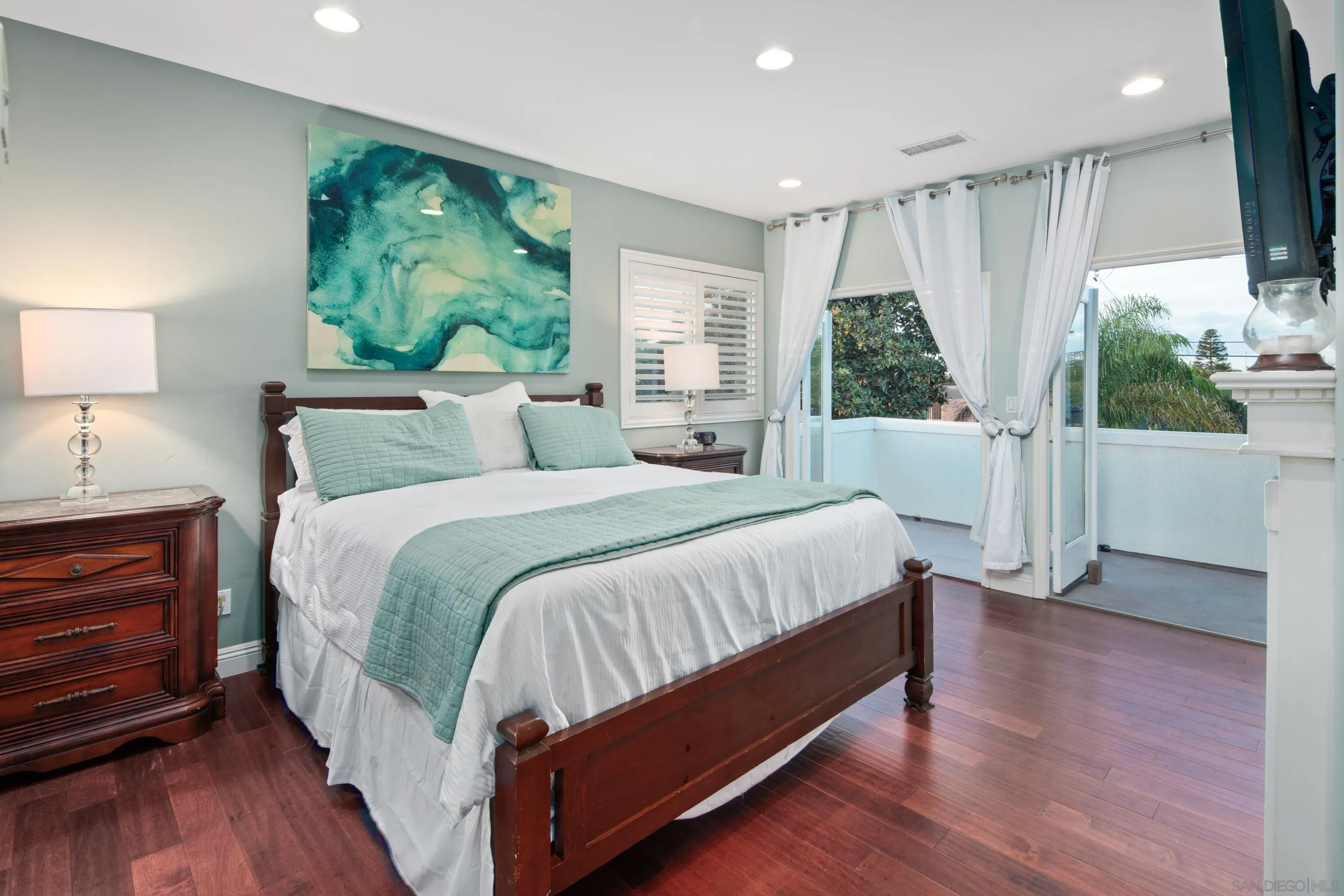 761 Ocean Crest Road Cardiff, CA 92007 - Photo 7 of 37 a bed room with a bed and a large window