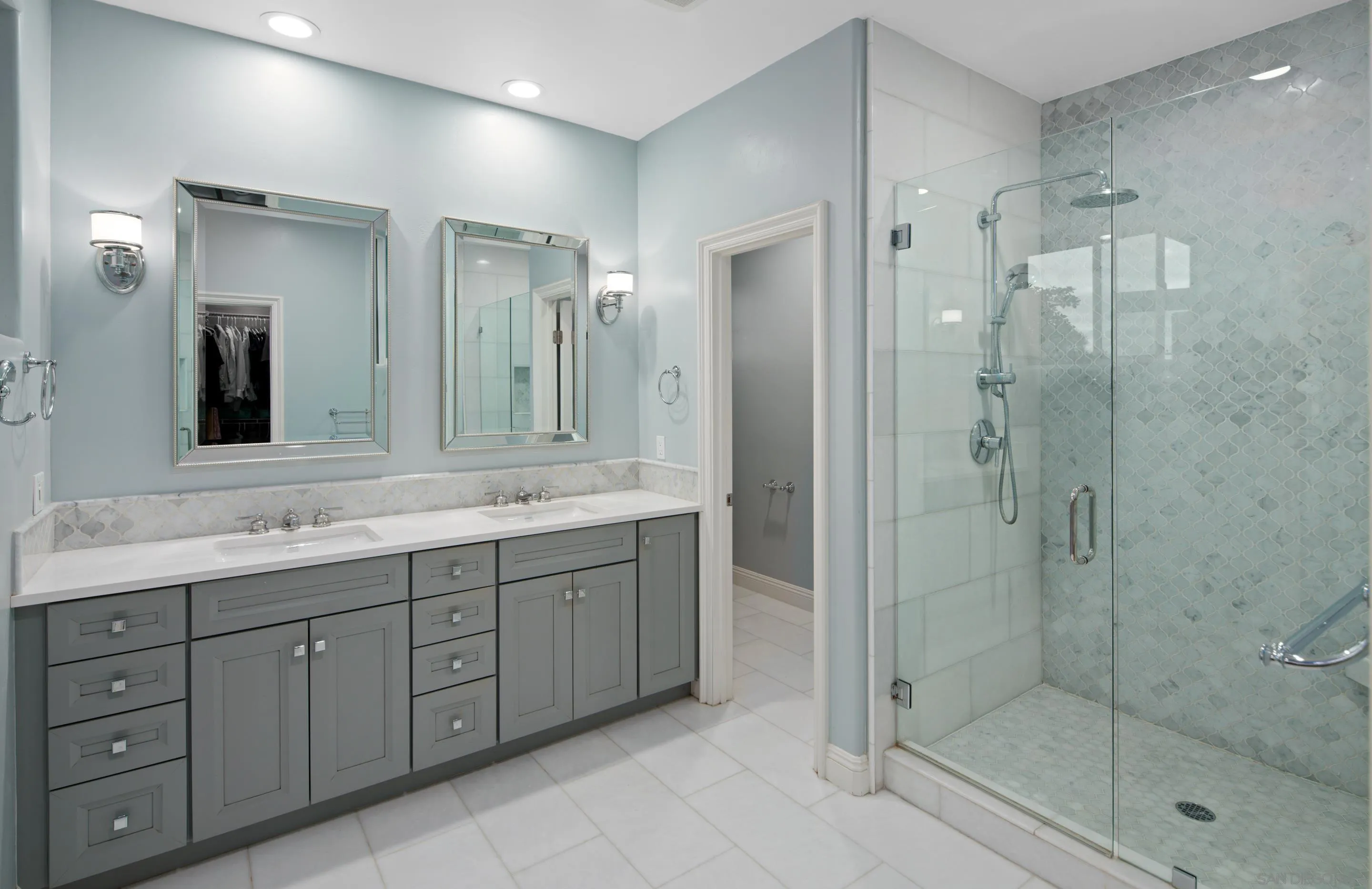 761 Ocean Crest Road Cardiff, CA 92007 - Photo 10 of 37 a bathroom with a shower sink and mirror