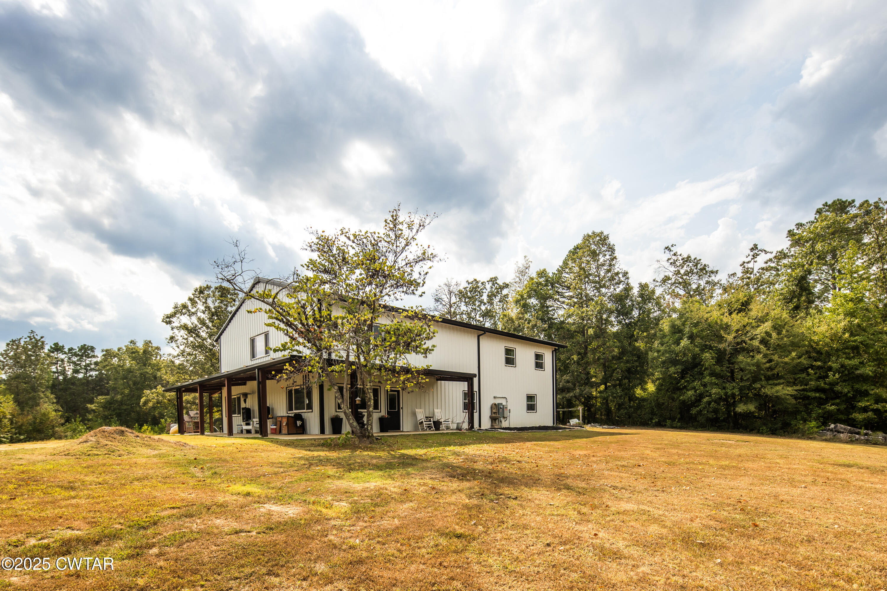 3670 Peavine Road Middleton, TN 38052 - Photo 1 of 29 a front view of a house with a yard and garage