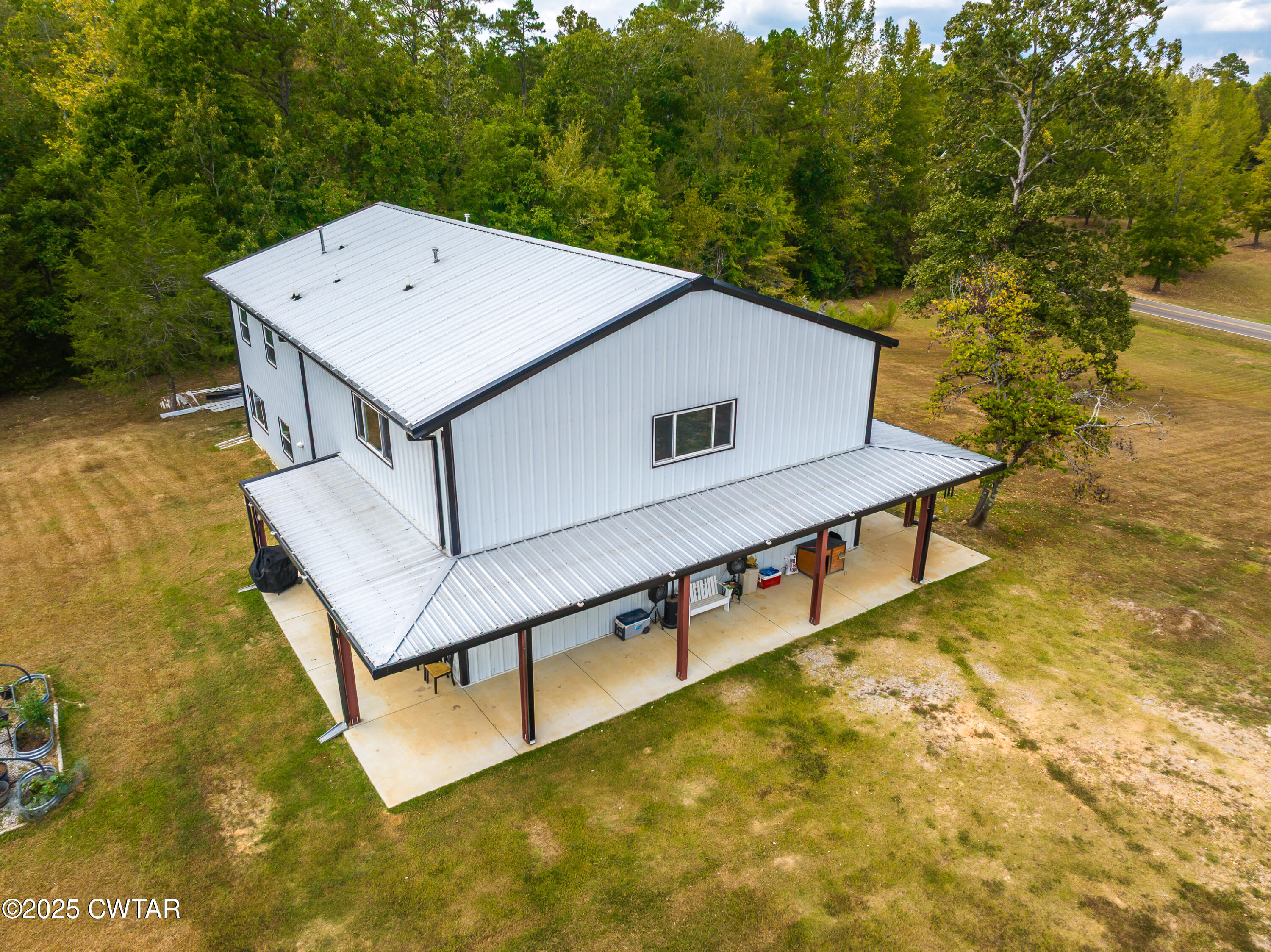 3670 Peavine Road Middleton, TN 38052 - Photo 2 of 29 a house with swimming pool in front of it