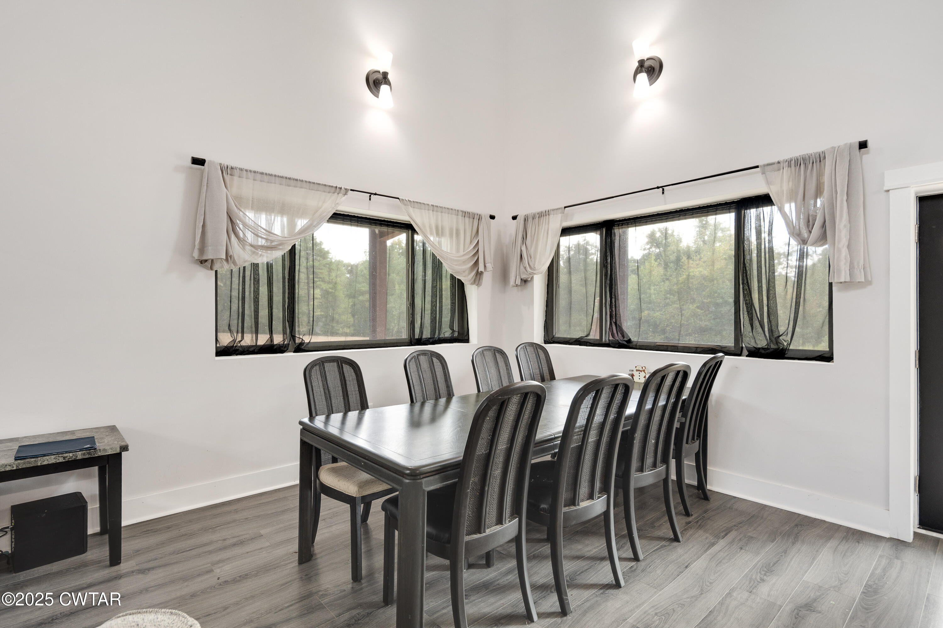3670 Peavine Road Middleton, TN 38052 - Photo 6 of 29 a view of a dining room with furniture window and wooden floor