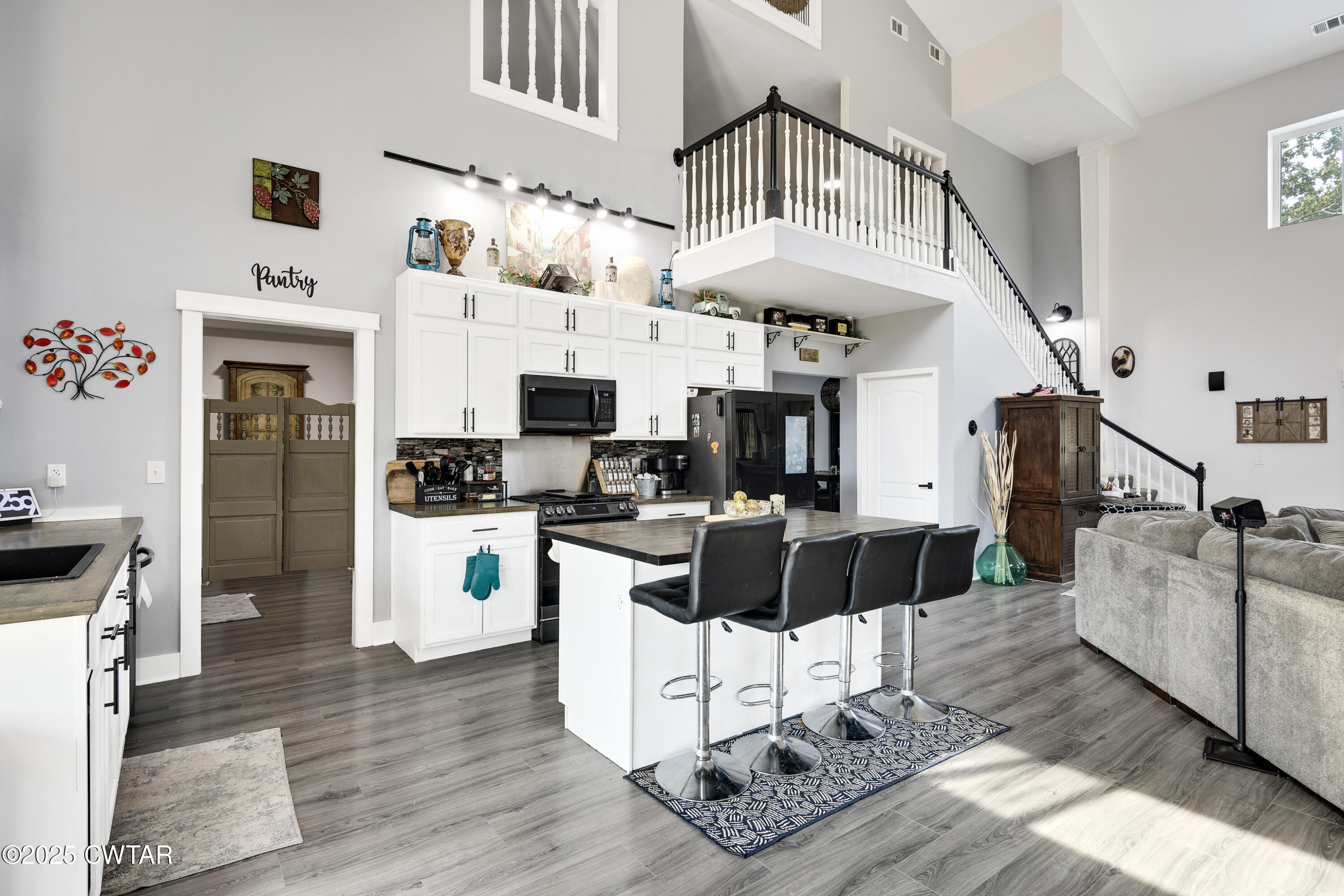 3670 Peavine Road Middleton, TN 38052 - Photo 7 of 29 a living room with furniture appliances and kitchen view