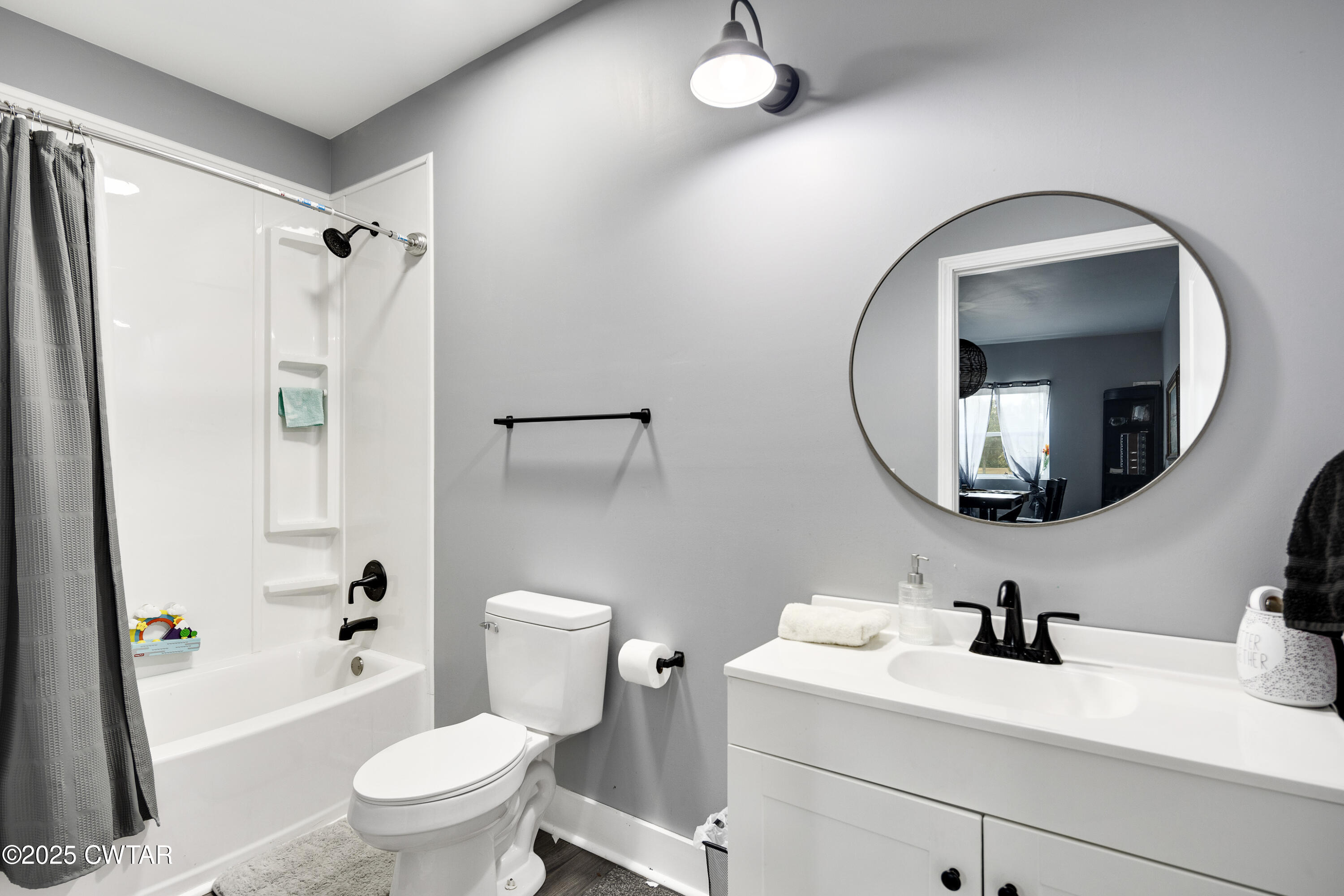 3670 Peavine Road Middleton, TN 38052 - Photo 10 of 29 a bathroom with a sink a toilet and a mirror
